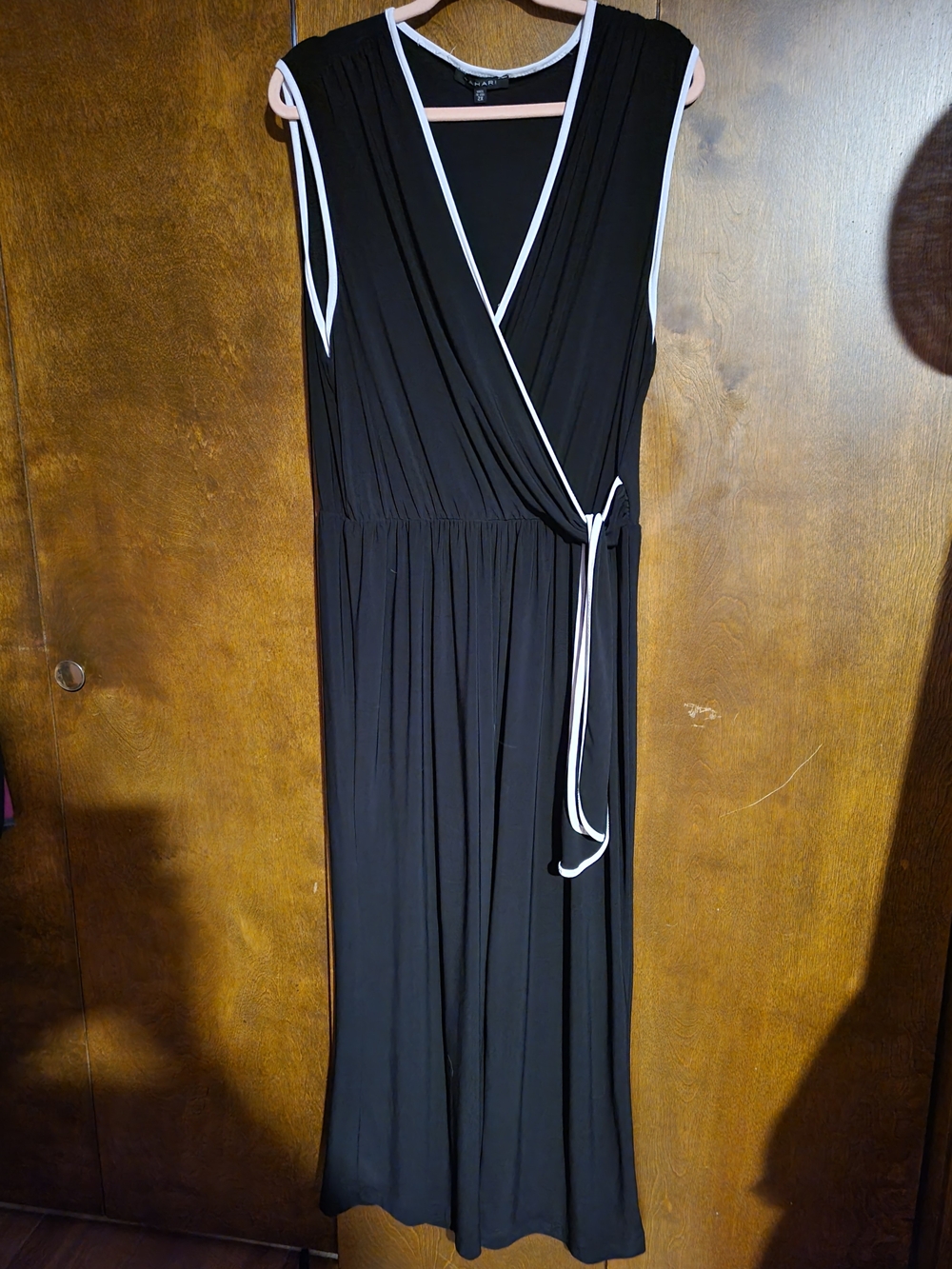 Black Wrap Pantsuit with White Trim - Classic Sleeveless Style